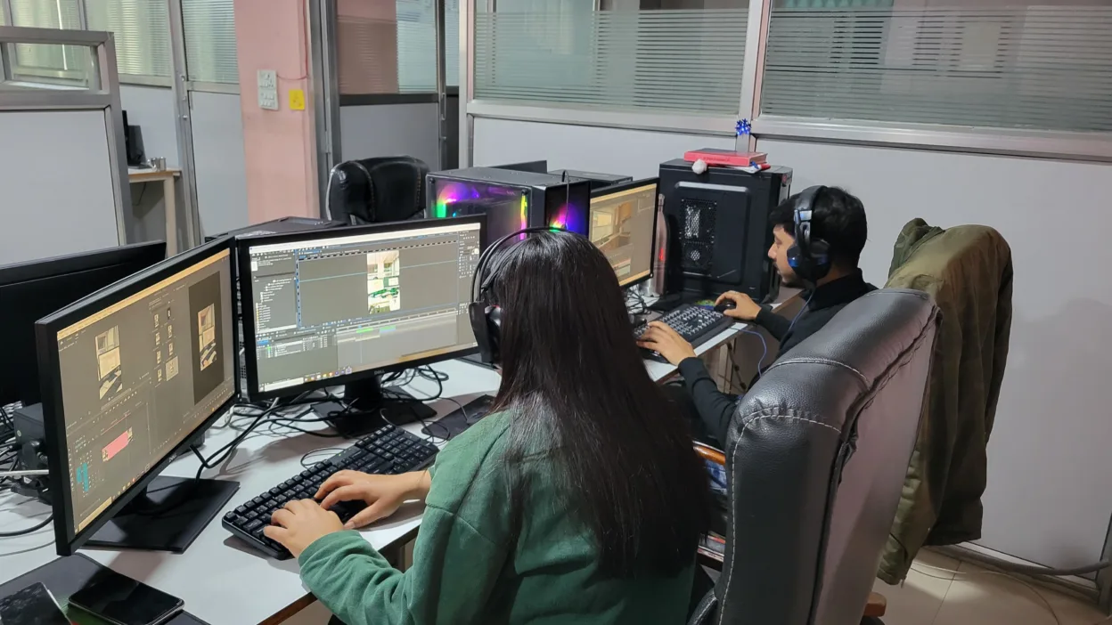 Video team collaborating on a project in the studio