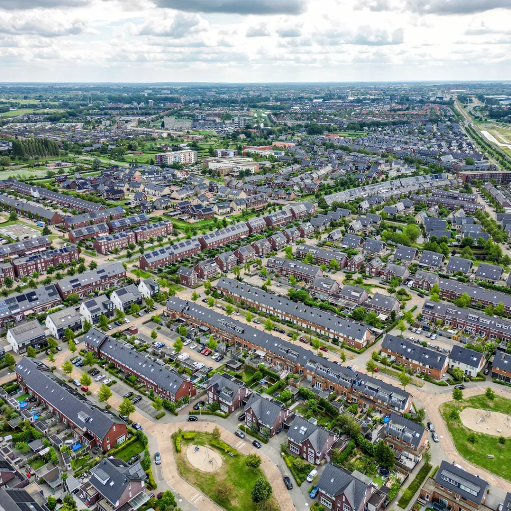 Edited drone image of a large residential property, highlighting the surrounding landscape and improving clarity, color balance, and detail for a more vibrant aerial view.