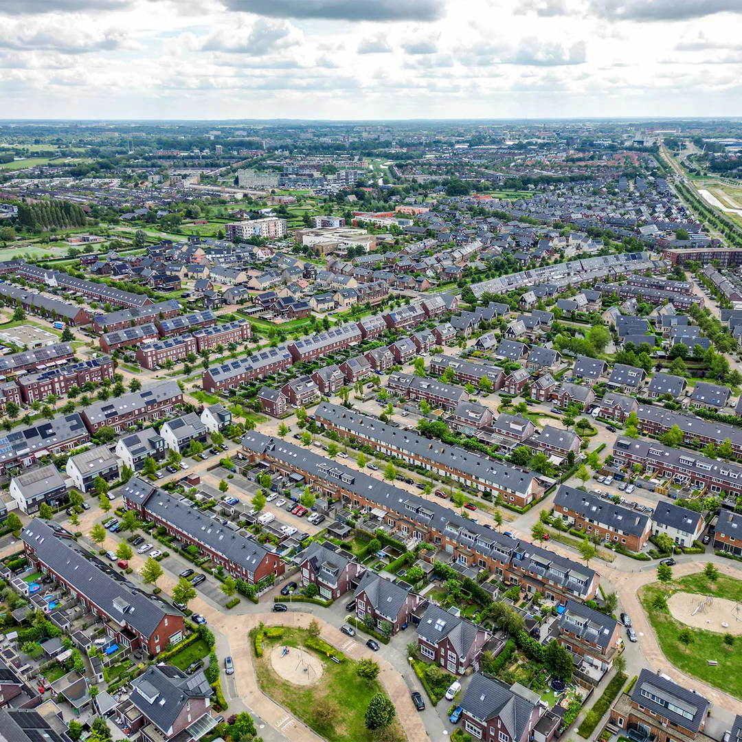 Edited drone image of a large residential property, highlighting the surrounding landscape and improving clarity, color balance, and detail for a more vibrant aerial view.