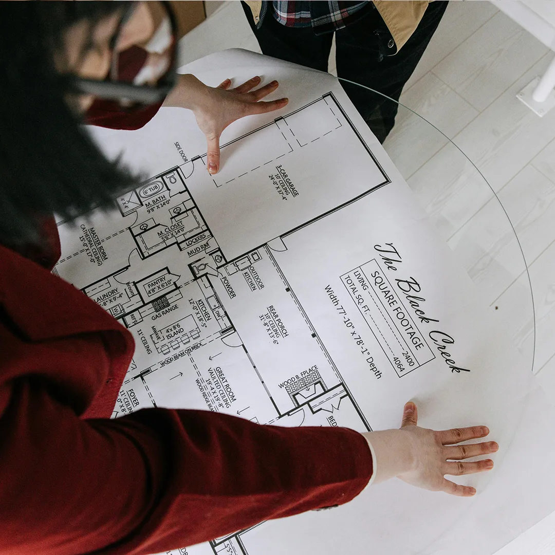 2D floor plan of a house layout, showing the arrangement of rooms, doors, and windows with dimensions clearly marked.